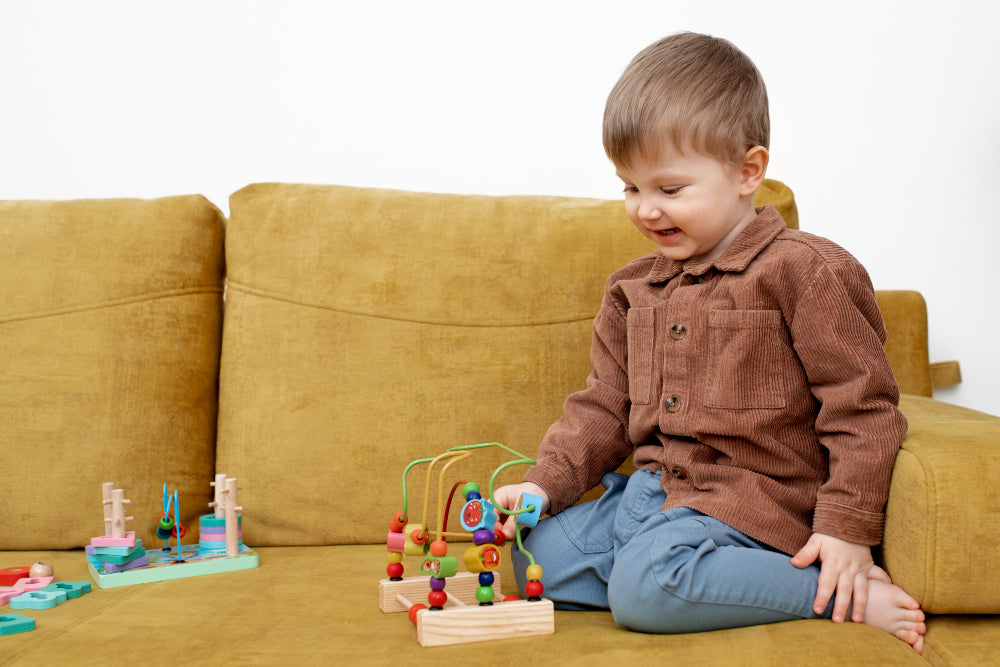 child playing with educational wooden beads