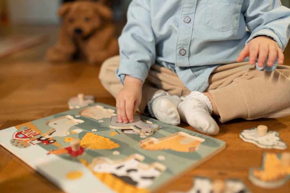Preschool learning kid with wooden animal puzzle