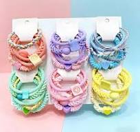 Multi textured pastel hair ties with decorative charms