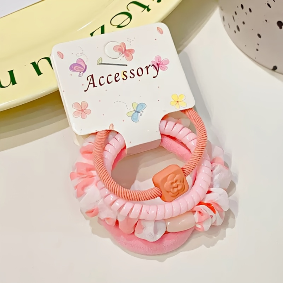 Pink Elastic ruffled scrunchies paired with decorative charm